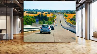 Car on the road at in Sardinia Island in Italy summer. Transport driving on the highway of Europe. View on motorway. Olbia province. Mixed media. Wall mural