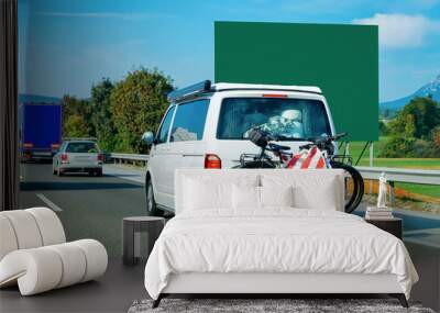 Mini van with bicycles in Road in Slovenia Wall mural