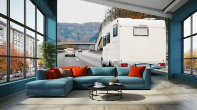 White Camper rv in road. Caravan on highway. Transport with driver. Motorhome vehicle for journey traveling. Wall mural