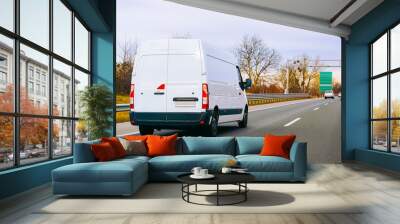 White Minivan on road on driveway van transport reflex Wall mural