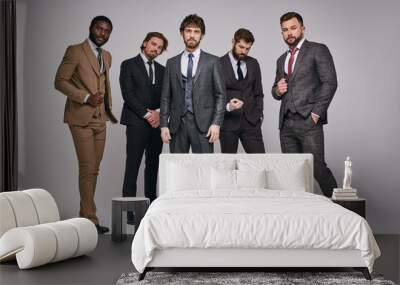 bearded brutal guys in classic suits posing with serious facial expression, young men in tux looking at camera, smart and intelligent. portrait Wall mural