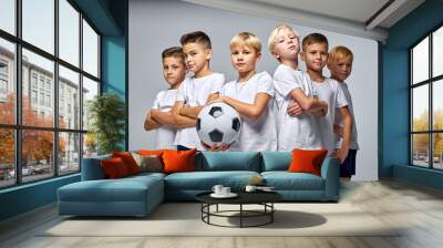 children soccer team isolated in studio, friendly kids sport family leisure lifestyle concept. copy space advertisement Wall mural