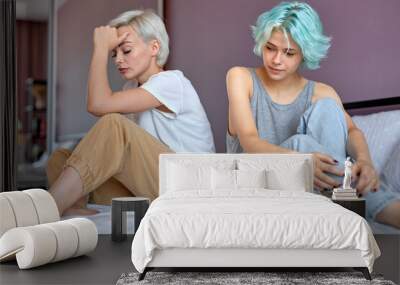 Couple diverse stress, LGBT lifestyle concept, Young caucasian lesbian couple argued with unhappy emotion sitting on bed, homosexual ladies in bad relationship, at home in cozy room, in casual wear Wall mural