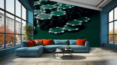 green casino chips lie on a green background Wall mural