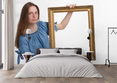 A young girl with long hair in a blue dress. Isolated on a white background Wall mural