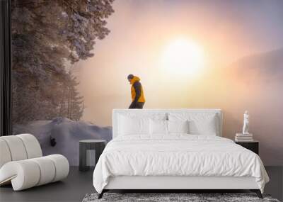 Man in frost bright sunny winter day. Adventure, outdoor activities, healthy lifestyle. Wall mural