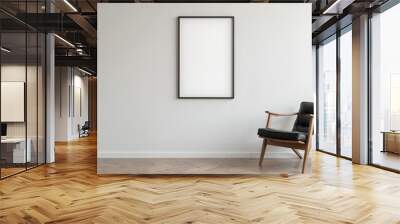 Minimalist interior with a black leather armchair, a potted plant, and a large empty frame on a white wall. Wall mural