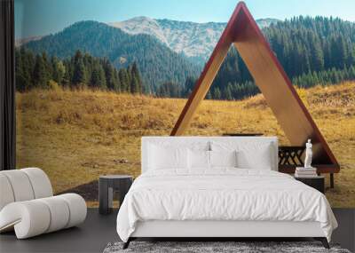 Modern gazebo on a tourist trail with a picturesque view of the summer mountains Wall mural