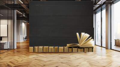 Open book, hardback books on wooden table. Back to school. Copy space Wall mural