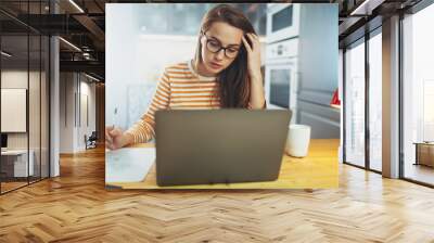 Online education, Beautiful student girl in eyeglasses studying at home using modern laptop, pretty woman making courses on literature or premium business courses for executives from home  on notebook Wall mural