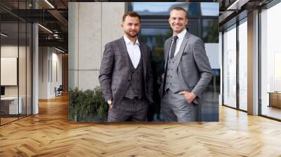 portrait of confident business partners outdoors, two caucasian men look at camera, wearing formal suit Wall mural