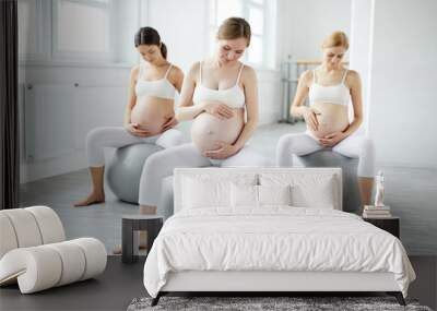 relaxed pregnant women lead active healthy lifestyle, going for yoga fitness sport Wall mural