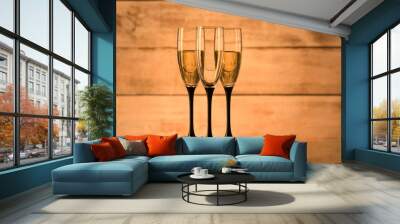 Glasses with champagne and empty glasses Wall mural