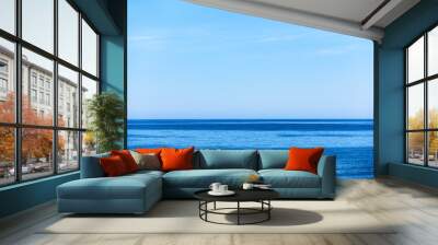 Sea and light blue sky Wall mural