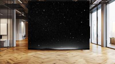 Starry night sky with a few stars above a field Wall mural