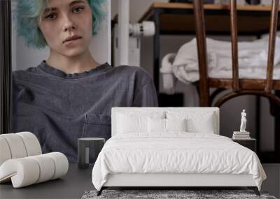 worried young woman in casual wear sit on bedroom floor alone troubled with loneliness, biting lips, upset about solitude mental problem look at camera think about problems, crisis Wall mural