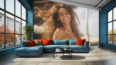 a beautiful young caucasian woman dancing at the beach on a vacation in summer, the sea or ocean water behind her Wall mural