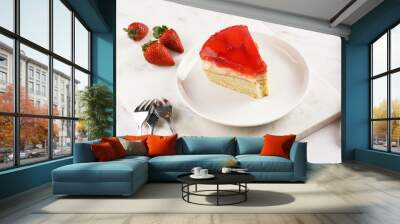 a Piece of a three-layered cake with vanilla pudding, strawberry jelly and fresh strawberries on a white marble background Wall mural