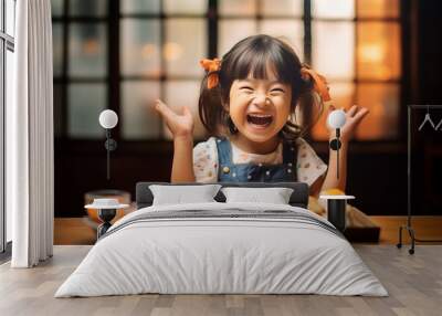 cute little cheerful asian girl happy about many sushi rolls in front of her ready to eat them Wall mural