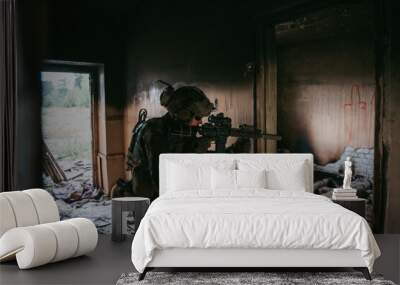 Soldier in full US MARSOC equipment entering abandoned building, aiming different angles with MK18 assault rifle Wall mural