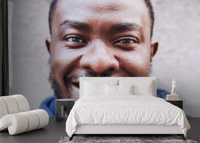 Black guy. Close-up face portrait. African American cheerful smiling man. Racial equality, photogenic, joy on the face Wall mural