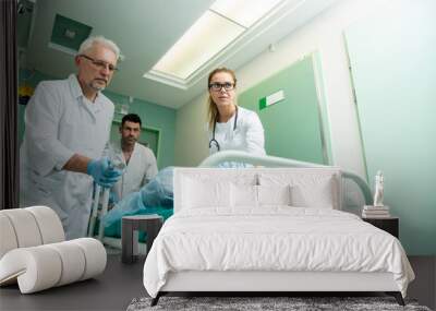 Team of Professional Surgeons and Nurses Suture Wound after Successful Surgery. Wall mural