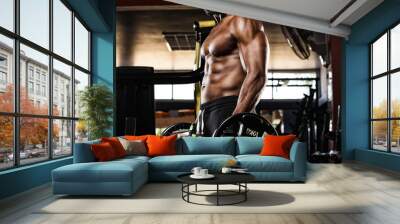 young man doing heavy weight exercise for biceps Wall mural