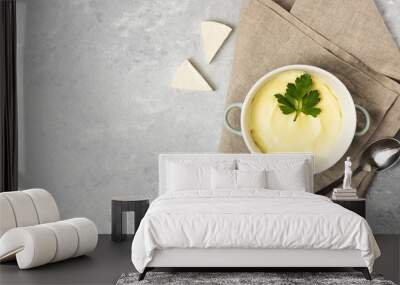 Cheese cream soup on gray marble stone table. Wall mural