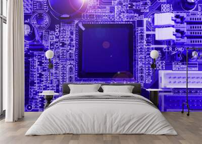 Integrated semiconductor microchip on blue circuit board representative of the high tech industry and computer science Wall mural