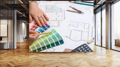 architects hands working with drawing sketch home, color sample and other working tools Wall mural