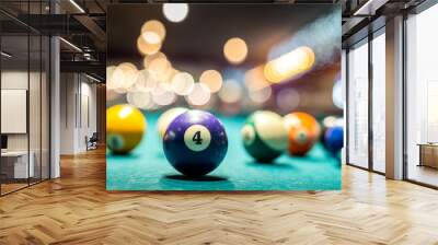 beautiful multi-colored balls with numbers lie under the light of lamps on the pool table. Wall mural