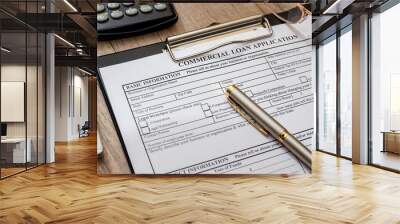 File the commercial loan application with calculator, pen on desk Wall mural