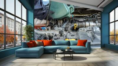 mechanic change oil to engine, car servicing Wall mural