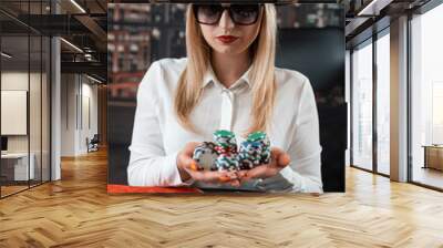 Pretty young  women posing at playing table in casino Wall mural