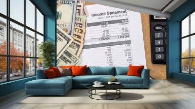 Save money concept - doc income statement with pen, calculator and money. Wall mural