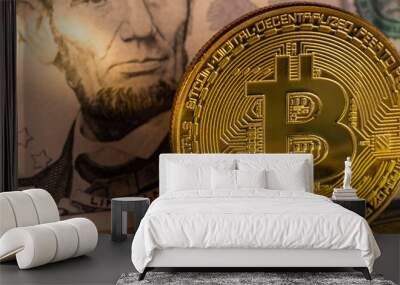 golden bitcoin coin on us dollars close up Wall mural