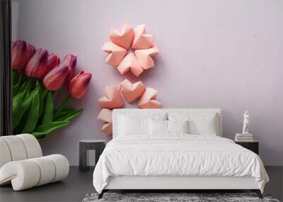 rose pink color paper hearts shape figure eight 8 on lilac  background Wall mural