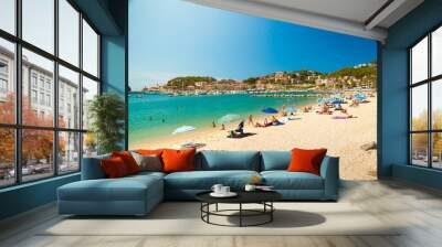 Colorful umbrellas on Puerto de Soller, Port of Mallorca island in balearic islands, Spain. Beautiful picture of people resting on the beach on bright summer day. Wall mural