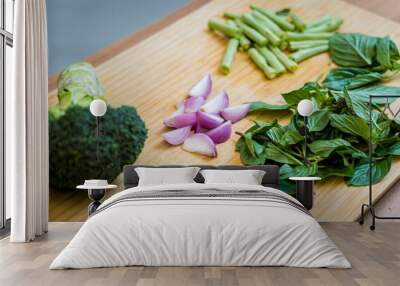 Cutting board with ingredients for preparing green curry with herbs and rice Wall mural