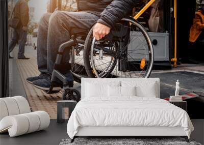 Person with a physical disability exits public transport with an accessible ramp. Wall mural