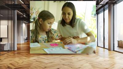 Teacher in workshop teched two girls how to assemble a thermo mosaic  Wall mural