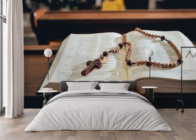 the wooden cross over opened bible on wooden table Wall mural