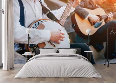 View of musician playing banjo at the street Wall mural