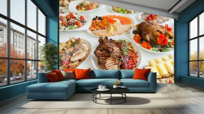 Beautiful festive table served for wedding celebration dinner at home or restaurant interior. Table full of food at a restaurant.  Full round table. Wall mural