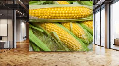 Fresh corn on cobs on rustic wooden table, close up. Sweet corn ears background Wall mural