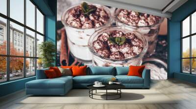 Tiramisu cake in glass, classic Italian dessert with mascarpone cream and cocoa. selective focus. Wall mural