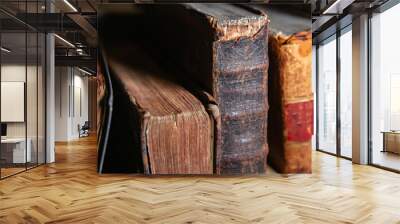 Very old books sitting on the shelves in the library. Books as a symbol of knowledge. Wall mural