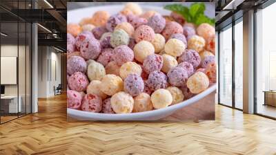 Colorful cereal corn balls mix sweets in a bowl on gray cement background. Wall mural