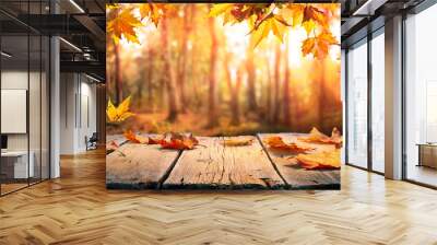 Autumn Table - Orange Leaves And Wooden Plank At Sunset In Forest Wall mural