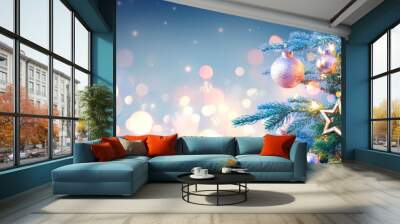 Christmas Tree With Golden Baubles And Shiny Lights In Blue Background Wall mural